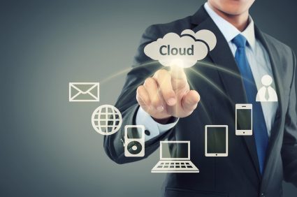 Business man pointing at cloud computing